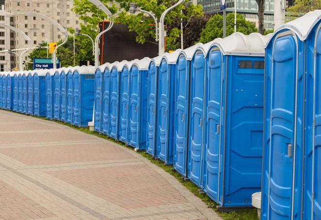 hygienic portable restrooms lined up at a beach party, ensuring guests have access to the necessary facilities while enjoying the sun and sand in Chilton WI